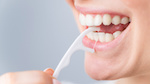 Person using interdental brush_459244818