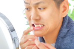 dark-gums-after-ceramic-treatment-causes-and-solutions_106630426_M